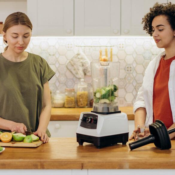 Two women making smoothie